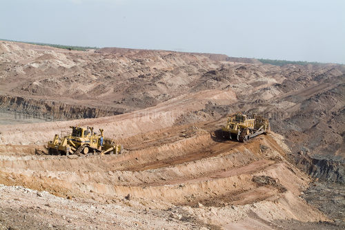 Two bulldozers pushing overburden to expose product. - Mining Photo Stock Library