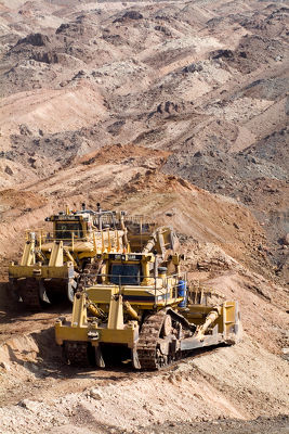 Two bulldozers pushing overburden to expose product. - Mining Photo Stock Library