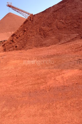 Conveyor stockpiling bauxite.  shot vertical - Mining Photo Stock Library