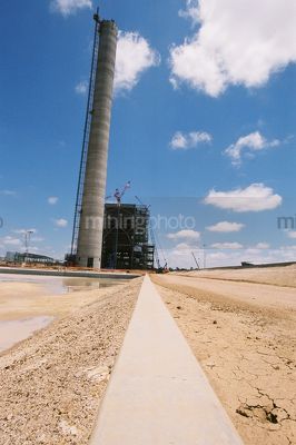 Smokestack and concrete edging at power station construction - Mining Photo Stock Library