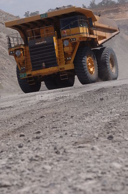 Large haul truck coming up haul road - Mining Photo Stock Library