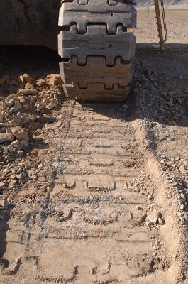 Excavator track shot up close - Mining Photo Stock Library