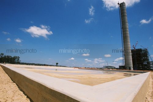 Corner of concrete slab at power station construction site - Mining Photo Stock Library