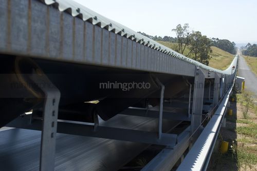 Covered coal conveyor - Mining Photo Stock Library