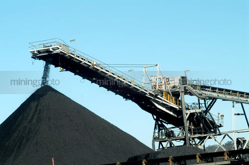Coal loader stockpiling - Mining Photo Stock Library