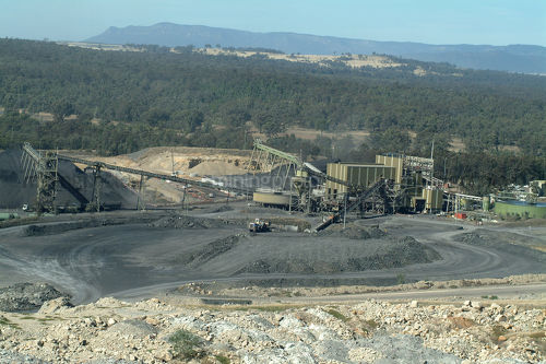 Wide shot of coal wash plant with conveyors and stockpiles. - Mining Photo Stock Library