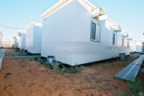 Temporary huts that make the camp that oil and gas rig workers live in during their shift. - Mining Photo Stock Library
