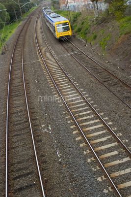 Domestic passenger light rail train.  shot from bridge - Mining Photo Stock Library