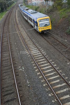 Domestic passenger light rail train.  shot from bridge - Mining Photo Stock Library