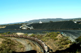 Mining Photo Stock Library - heavy rail carriages with stockpiled coal and coal track loader behind.  aerial image ( Weight: 2  New Image: NO)