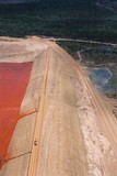 Mining Photo Stock Library - mine truck driving atop tailings dam wall. aerial photo ( Weight: 3  New Image: NO)