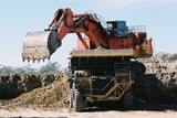 Mining Photo Stock Library - large digger loading overburden into haul truck on opencut mine site ( Weight: 3  New Image: NO)