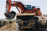 Mining Photo Stock Library - large digger loading overburden into haul truck in an opencut mine ( Weight: 1  New Image: NO)