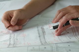 Mining Photo Stock Library - closeup of hands with pen and pencil above engineering plans. good generic shot ( Weight: 1  New Image: NO)