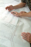 Mining Photo Stock Library - closeup of hands above engineering property plans ( Weight: 3  New Image: NO)