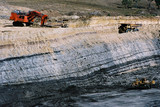 Mining Photo Stock Library - bulldozer stockpiling coal opencut mine floor while excavator loads haul trucks with overburden on bench above coal seam. ( Weight: 1  New Image: NO)