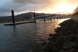 Mining Photo Stock Library - sunset with jetty to a pontoon in foreground.  residential property. ( Weight: 1  New Image: NO)