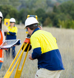 Mining Photo Stock Library - surveyor and linesperson in fuyll PPE working in the field ( Weight: 3  New Image: NO)