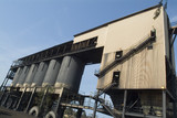 Mining Photo Stock Library - large hopper silo bins deliver product to waiting trucks below ( Weight: 1  New Image: NO)