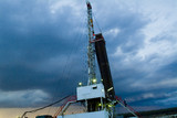 Mining Photo Stock Library - drill rig and derrick shot at sunset with storm behind ( Weight: 2  New Image: NO)