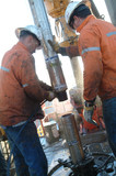 Mining Photo Stock Library - drill rig workers attaching pipe casing to hole ( Weight: 1  New Image: NO)