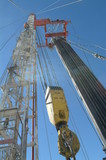 Mining Photo Stock Library - looking up the derrick with pipe casing hanging on drill rig ( Weight: 3  New Image: NO)