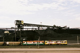 Mining Photo Stock Library - coal train at wharf terminal with coal stockpiles in background. aerial shot ( Weight: 1  New Image: NO)