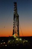 Mining Photo Stock Library - drill rig derrick with lights on shot at sunset. ( Weight: 1  New Image: NO)