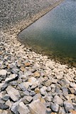 Mining Photo Stock Library - closeup of the edge of a rock wall leading to dam and water feature ( Weight: 3  New Image: NO)