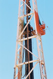 Mining Photo Stock Library - drill rig worker high up the derrick loading pipe into the hole ( Weight: 2  New Image: NO)