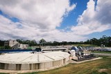 Mining Photo Stock Library - large, round concrete water separation tank at water treatment works.  blue sky. ( Weight: 1  New Image: NO)