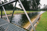 Mining Photo Stock Library - hydro water flowing along concrete channels towards city hydro power plant.  bridge across channel. ( Weight: 1  New Image: NO)