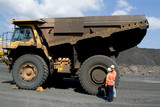 Mining Photo Stock Library - female truck driver being instructed by mine worker.  standing next to large haul truck. ( Weight: 1  New Image: NO)