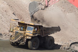 Mining Photo Stock Library - haul truck being loaded by excavator. shot from slightly above. ( Weight: 2  New Image: NO)