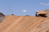 Mining Photo Stock Library - loaded haul truck carries overburden along haul road  ( Weight: 2  New Image: NO)