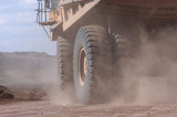 Mining Photo Stock Library - haul truck turning in a cloud of dust on a mine site road.  shot close ( Weight: 1  New Image: NO)