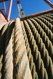 Mining Photo Stock Library - rope cable stretched tight n cable drum on mine site.  shot close up. ( Weight: 5  New Image: NO)
