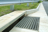 Mining Photo Stock Library - closeup of storm water drain on the edge of a road. ( Weight: 2  New Image: NO)