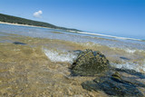 Mining Photo Stock Library - clean beach with ocean surf water breaking over rocks. shot from water level  ( Weight: 4  New Image: NO)