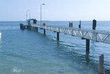 Mining Photo Stock Library - person walking along pedestrian jetty above ocean. ( Weight: 3  New Image: NO)