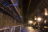 Mining Photo Stock Library - mine worker underground walking towards camera with coal conveyors adjacent. movement in shot. ( Weight: 4  New Image: NO)
