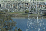 Mining Photo Stock Library - electricity tower and substation in background with lake in foreground.  ( Weight: 4  New Image: NO)