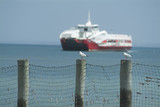 Mining Photo Stock Library - car and passenger ferry on open ocean with seagulls on post fence in focus in foreground. ( Weight: 1  New Image: NO)