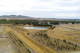 Mining Photo Stock Library - covered coal conveyor in background with small lake and open cut rehabilitation planting in foreground. aerial shot. ( Weight: 1  New Image: NO)