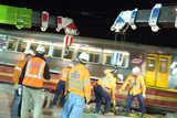 Mining Photo Stock Library - rail track workers in full PPE with light rail going past next to them. lots of movement from the train. ( Weight: 1  New Image: NO)