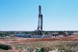 Mining Photo Stock Library - desert oil and gas rig during the day shot from afar to give scope of remote location. ( Weight: 5  New Image: NO)