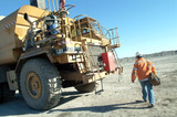 Mining Photo Stock Library - female worker arriving at large water cart on mine site. ( Weight: 4  New Image: NO)