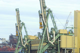 Mining Photo Stock Library - bulk ship loaders at terminal with ship in background. shot up close. ( Weight: 2  New Image: NO)