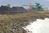 Mining Photo Stock Library - coal loaders stockpiling with surf and ocean hitting rock retaining wall in foreground. ( Weight: 2  New Image: NO)