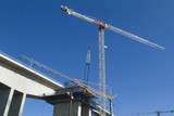 Mining Photo Stock Library - looking up at bridge construction with cranes and concrete pylons above.  ( Weight: 4  New Image: NO)